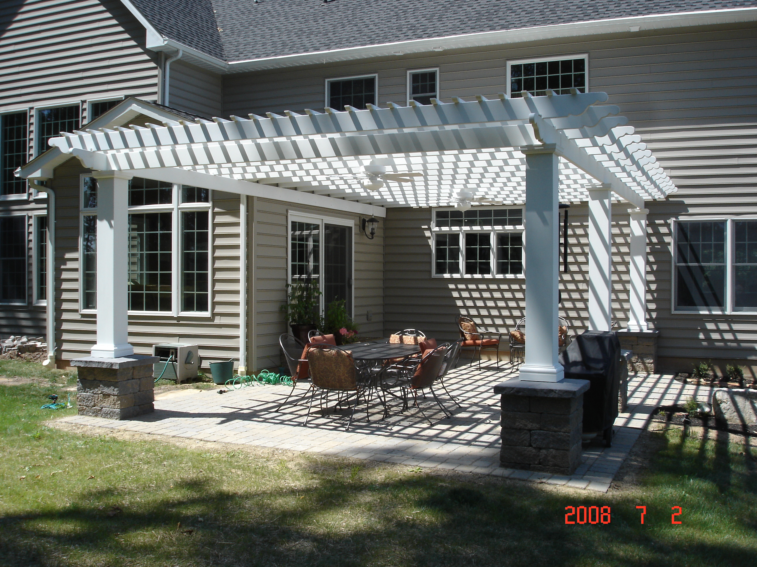 Attached to the house, this pergola defines the patio, providing 